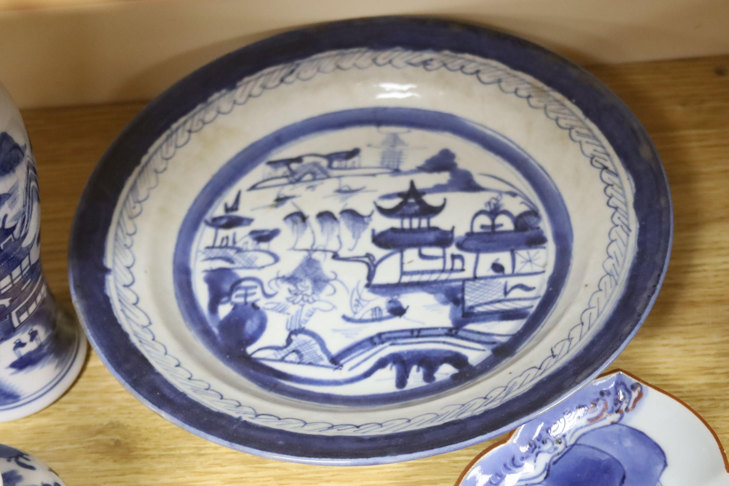 A group of Chinese blue and white vases and plates, 18th century/ 19th and a Japanese shaped dish